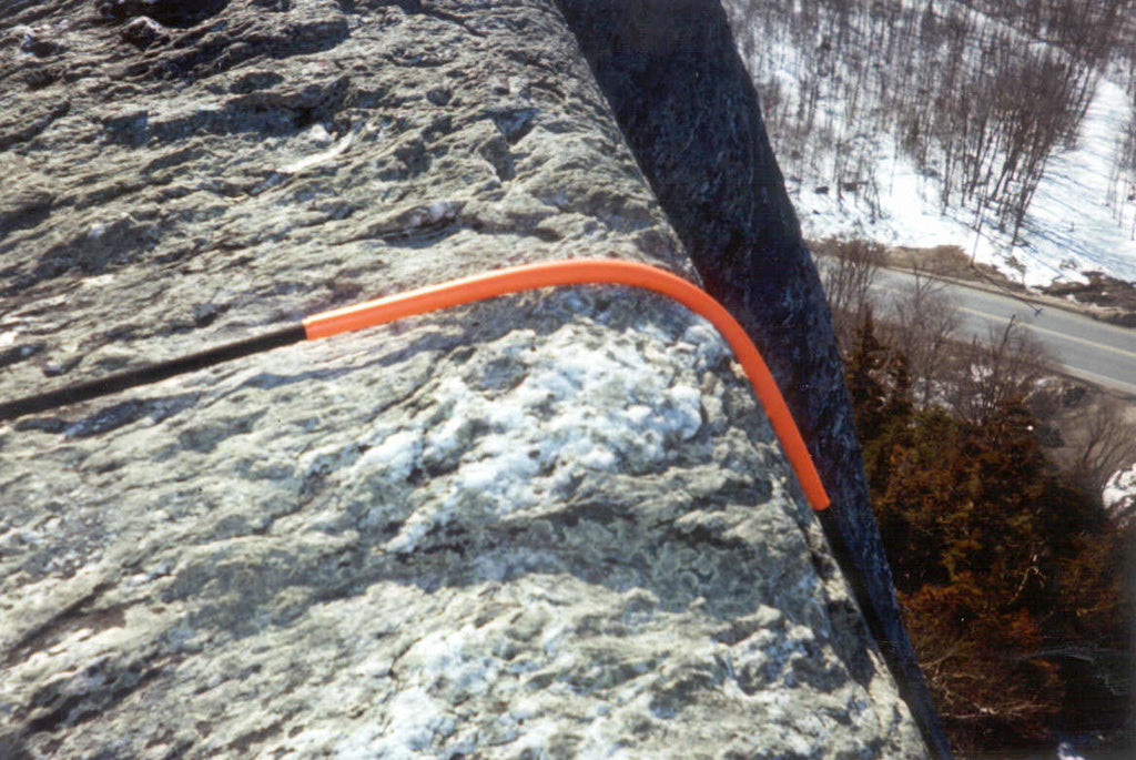 Spiroll Rope Protector protecting a rope over a sharp edge